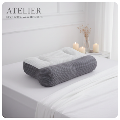 Atelier Cervical Support Pillow on white linen bedding